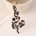Portachiavi vintage a forma di serpente dorato con smalto nero e strass multicolore - Nero