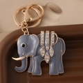 Grijze emaille olifant sleutelhanger met witte strassteentjes en gouden metalen rand - Grijs