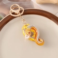 Golden zodiac snake keychain with yellow enamel, sparkling rhinestones and white pearl - Yellow
