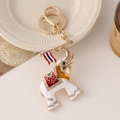 Cartoon elephant keychain with white enamel, gold plating, and colorful rhinestones - White