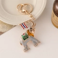 Golden elephant keychain with silver glitter, green enamel, and rhinestones on a hook - Gray