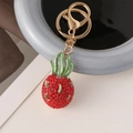 Portachiavi creativo a forma di frutto del drago con strass rossi e chiusura dorata - Rosso