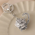 Drachenkopf Schlüsselanhänger in Silber mit weißen Kristallen und Metallverschluss - Antiksilber