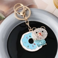 Lindo llavero de oso dona con esmalte azul cielo y detalles de cristal brillante - Azul