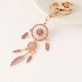 Elegant gold dreamcatcher keychain with pink rhinestones and feather charms on white background - Pink