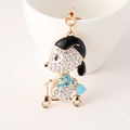 Sparkling crystal puppy riding scooter keychain with gold plating and blue rhinestones - Sky Blue
