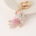 Einhorn Schlüsselanhänger in Gold mit weißen und rosa Kristallen und Emaille-Mähne - Rosa