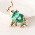 Golden elephant keychain pendant featuring green enamel and sparkling emerald rhinestones - Green