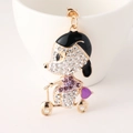 Cartoon girl on scooter keychain with gold metal plating and purple rhinestones - Purple
