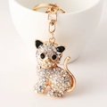 Eleganter Katzen Schlüsselanhänger mit funkelnden Strasssteinen in Gold für Damenhandtaschen - Kc Golden Cat 6623