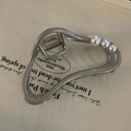 Detail of matte silver metal hair claw clip featuring large pearls and streamliner frame - Irregular Oval Pearl Hair Claw
