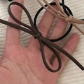 Detail of matte faux leather bow hair ties in deep brown and beige khaki colors - Khaki Bow Hair Tie / Khaki