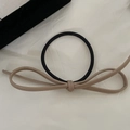 Close-up of minimalist leather bow hair clip with black elastic band on white background - Milk Tea Bow Hair Tie / Milk Tea