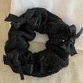 Macro shot of black sequin scrunchie featuring three elegant satin bow accents - Black Sequin Bow Style