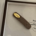 Detailed close-up of brown knitted BB hair clip featuring a golden handmade metal plate - Khaki Stripe (With Gold Plate)