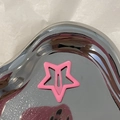 Macro shot of a pink star-shaped metal hair clip on a heart-shaped silver tray - Pentagram (BB Clip) / Rose Pink