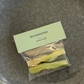 Detail of candy color wavy hair clips set in lime green and yellow resin finish - Green