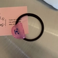 Close-up of a cute pink resin bear hair tie with high elastic black rubber band - Rose Red Bear Hair Tie
