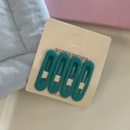 Set of four matte teal oval BB hair clips for girls displayed on a beige card holder - Hair Clip Set / Lake Blue