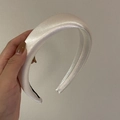 Detailed view of the anti-slip black inner strip on a premium white satin padded headband - Thickened / White