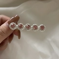 Zilveren haarspeld met vijf roze edelstenen en glanzende witte kristallen op een rij - Roze Strass Clip