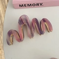 Macro view of wave shaped acetate hair claw clip with purple and pink marble texture - Wave Claw Clip / Purple Pink Marble