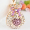 Golden money bag keychain with rhinestones and purple bow charm for handbag - Purple