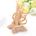 Eiffelturm Schlüsselanhänger in Gold mit rosa Strasssteinen für Taschen - Champagner