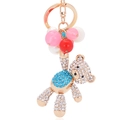 Portachiavi orsetto dorato con perle blu e rosse e dettagli in strass scintillanti - Blu