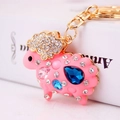 Pink resin sheep keychain with colorful rhinestones and gold-plated ring charm - Pink