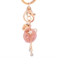 Pink lucky bag keychain with cat eye stone, rose gold accents and long tassels - Pink
