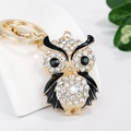Porte-clés chouette doré serti de strass blancs et détails en émail noir élégant - Noir