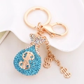 Llavero de bolsa de dinero en oro rosa con diamantes azules y símbolo de dólar - Azul lago