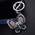 Glitzernder Schmetterling Schlüsselanhänger mit blauen Edelsteinen für Damen Handtaschen - Tintenblau