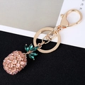 Pink resin pineapple keychain accessory with gold-plated metal clasp and green leaf details - Pink Opal Pineapple Style (4742)