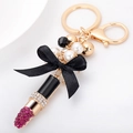Portachiavi a rossetto con fiocco nero e strass rossi su chiusura a moschettone dorata - Rosa Rosso