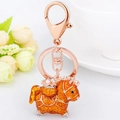 Lucky horse keychain in orange enamel with pearl lucky bag and rose gold finish - 10cm 3.5x4.5cm / Gold