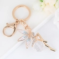 Exquise gouden engel sleutelhanger met witte emaille vleugels en kristallen hanger - Blauw