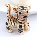 Golden tiger keychain pendant with champagne rhinestones and black enamel stripes - Champagne
