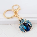 Exquisite golden ladybug keychain with blue crystals and sparkling rhinestone details - Blue