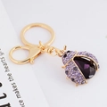Exquisite purple crystal ladybug keychain with golden alloy ring and beetle charm - Purple