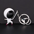 Creatieve astronaut sleutelhanger met witte emaille afwerking en roze accenten op zwart - Astronaut Figuur (CHY-5115) / Zwart Wit