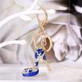 Golden high heel keychain with blue enamel star and crystals on white background - Blue
