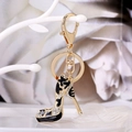 Golden high heel keychain with black enamel star pattern and sparkling rhinestones - Black