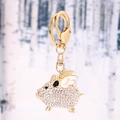 Portachiavi maialino volante dorato con strass in cristallo scintillanti e smalto - Bianco
