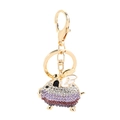 Golden flying pig keychain with gradient purple rhinestones and white wings decoration - Purple White