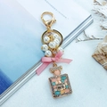 Elegant gold perfume bottle keychain with cat eye stones, pearls and pink ribbon bow - Perfume Bottle Style - Pink Bow (CHY-4474)