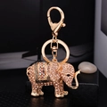 Elephant keychain in gold alloy with colorful rhinestones and lobster clasp - Champagne (5276)