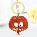 Creative Halloween pumpkin keychain with sparkling rhinestones and funny orange face design - Red