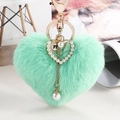 Mint green plush heart keychain with pearl embellishment and elegant golden clasp accessory - Green